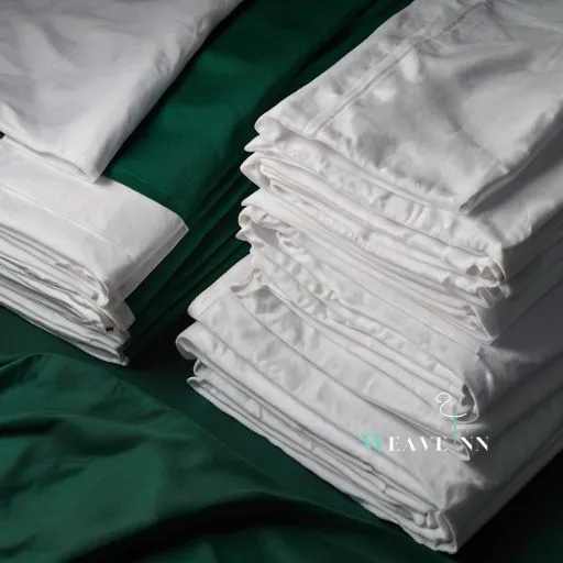 Hospital green and white sheets stacked